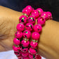 Pulsera de cuentas con chispas de color rosa intenso